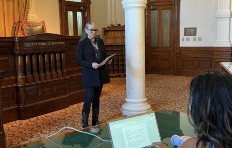 Texas State Representative Lulu Flores delivers a presentation to the Leadership Tejas class in the historic Supreme Court courtroom at the Texas State Capitol.